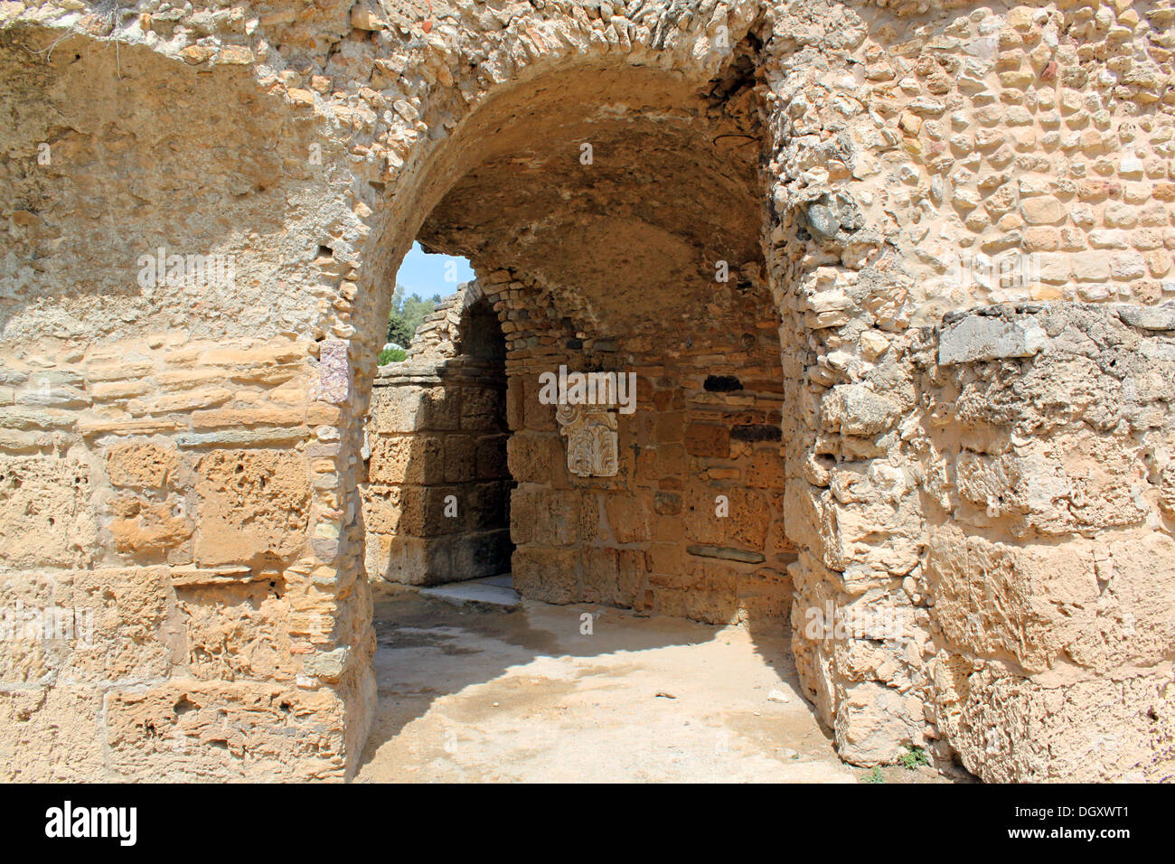 The passage in the stone wall Stock Photo - Alamy