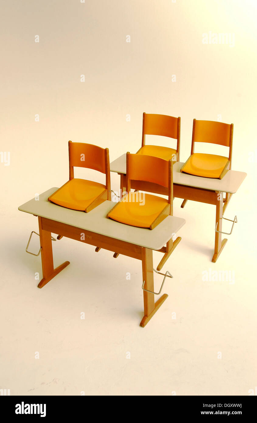 Old school desks with orange chairs Stock Photo