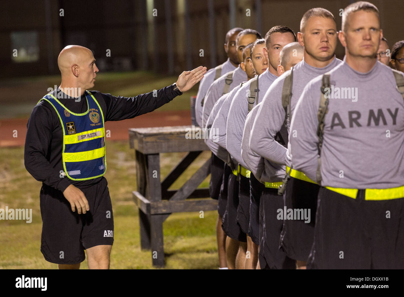 Sergeant Major Blaine J. Huston yells instructions to Drill Sergeant candidates at the US Army Drill Instructors School Fort Jackson line up before taking their physical training test early morning September 27, 2013 in Columbia, SC. While 14 percent of the Army is women soldiers there is a shortage of female Drill Sergeants. Stock Photo