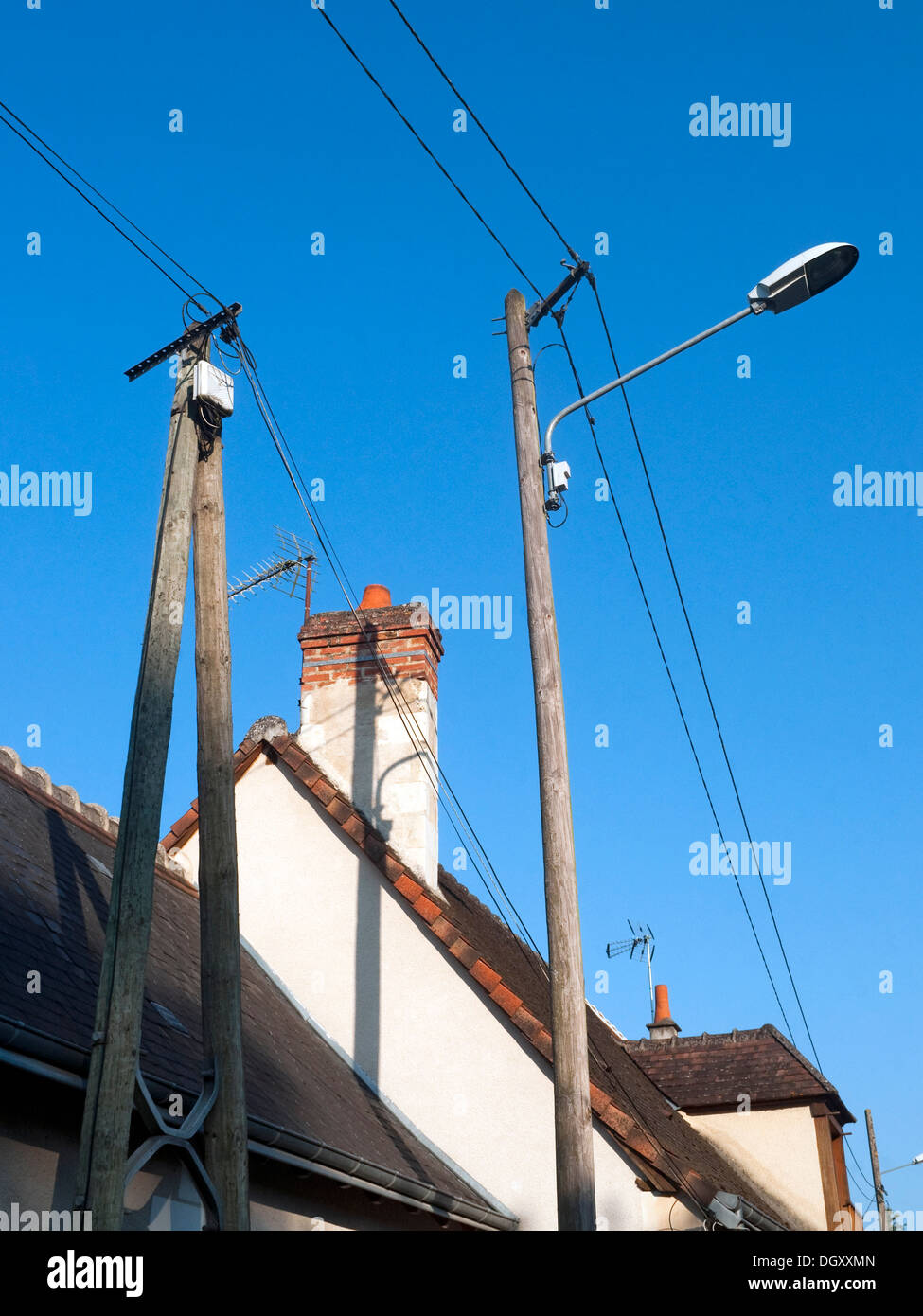 Street lamp and telephone poles / ugly urban pollution - France. Stock Photo