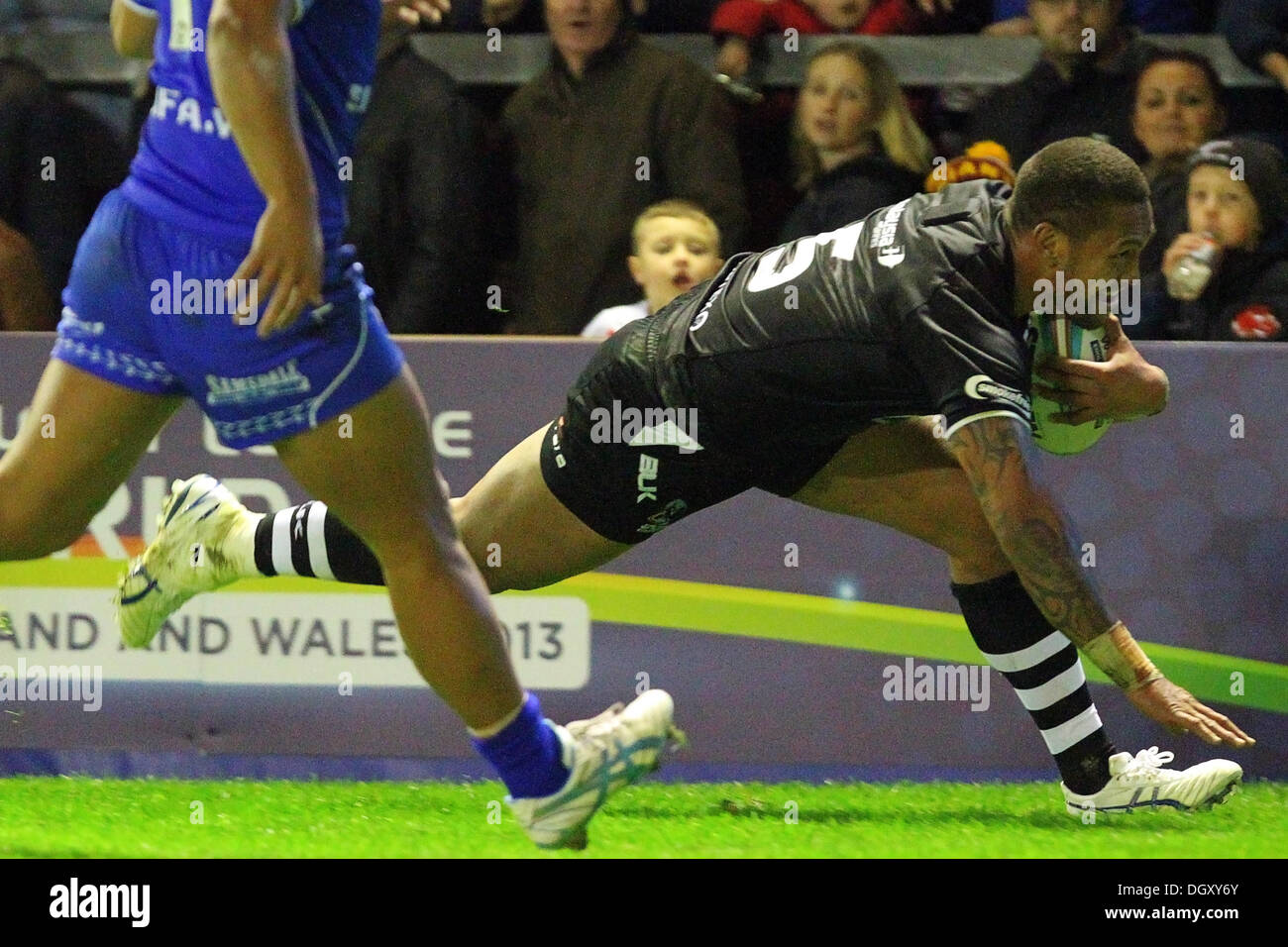Warrington, UK. 27th Oct, 2013. Manu Vatuvei (New Zealand &amp; New Zealand Warriors) dives across the line to score a try during the Rugby League World Cup Group B game between New Zealand and Samoa from the Halliwell Jones Stadium. Credit:  Action Plus Sports/Alamy Live News Stock Photo