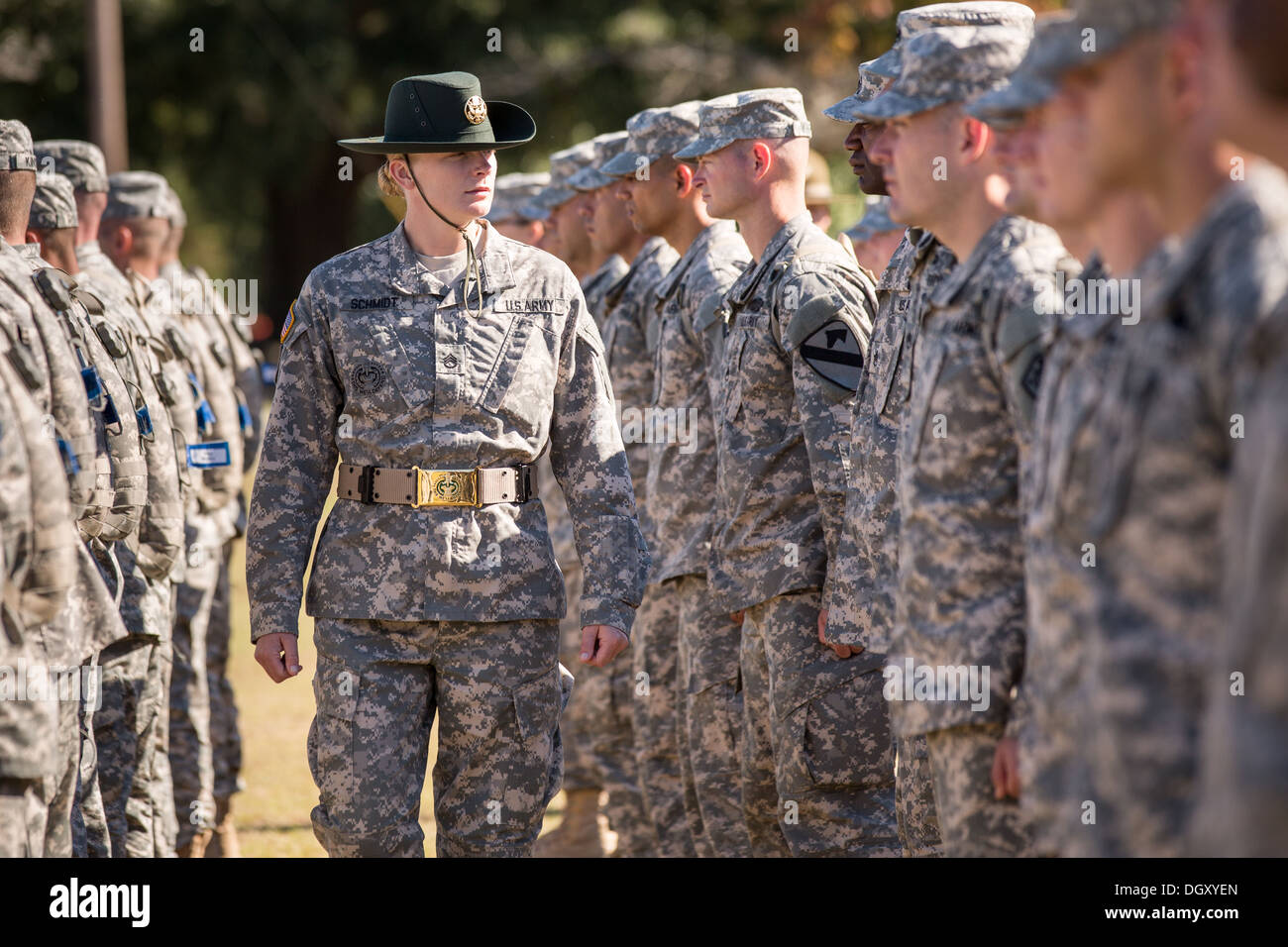 A female Drill Sergeant instructor observes candidates at the US Army Drill Instructors School Fort Jackson during close order drill exercises September 27, 2013 in Columbia, SC. While 14 percent of the Army is women soldiers there is a shortage of female Drill Sergeants. Stock Photo