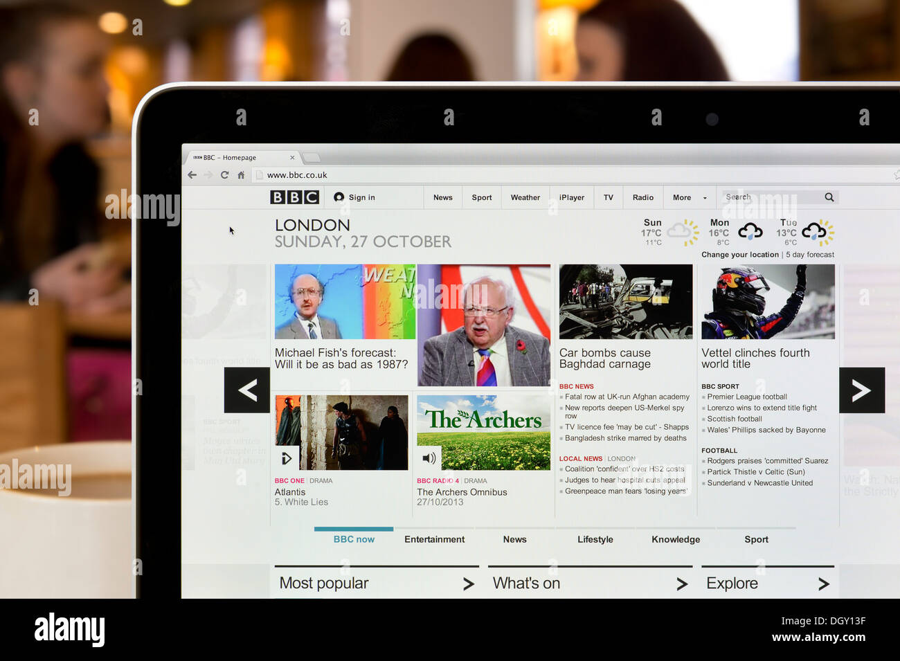 The BBC Online website shot in a coffee shop environment (Editorial use only: print, TV, e-book and editorial website). Stock Photo