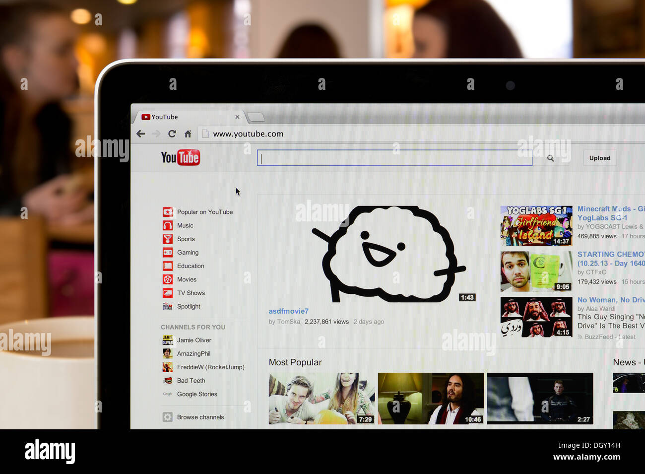 The YouTube website shot in a coffee shop environment (Editorial use only: print, TV, e-book and editorial website). Stock Photo