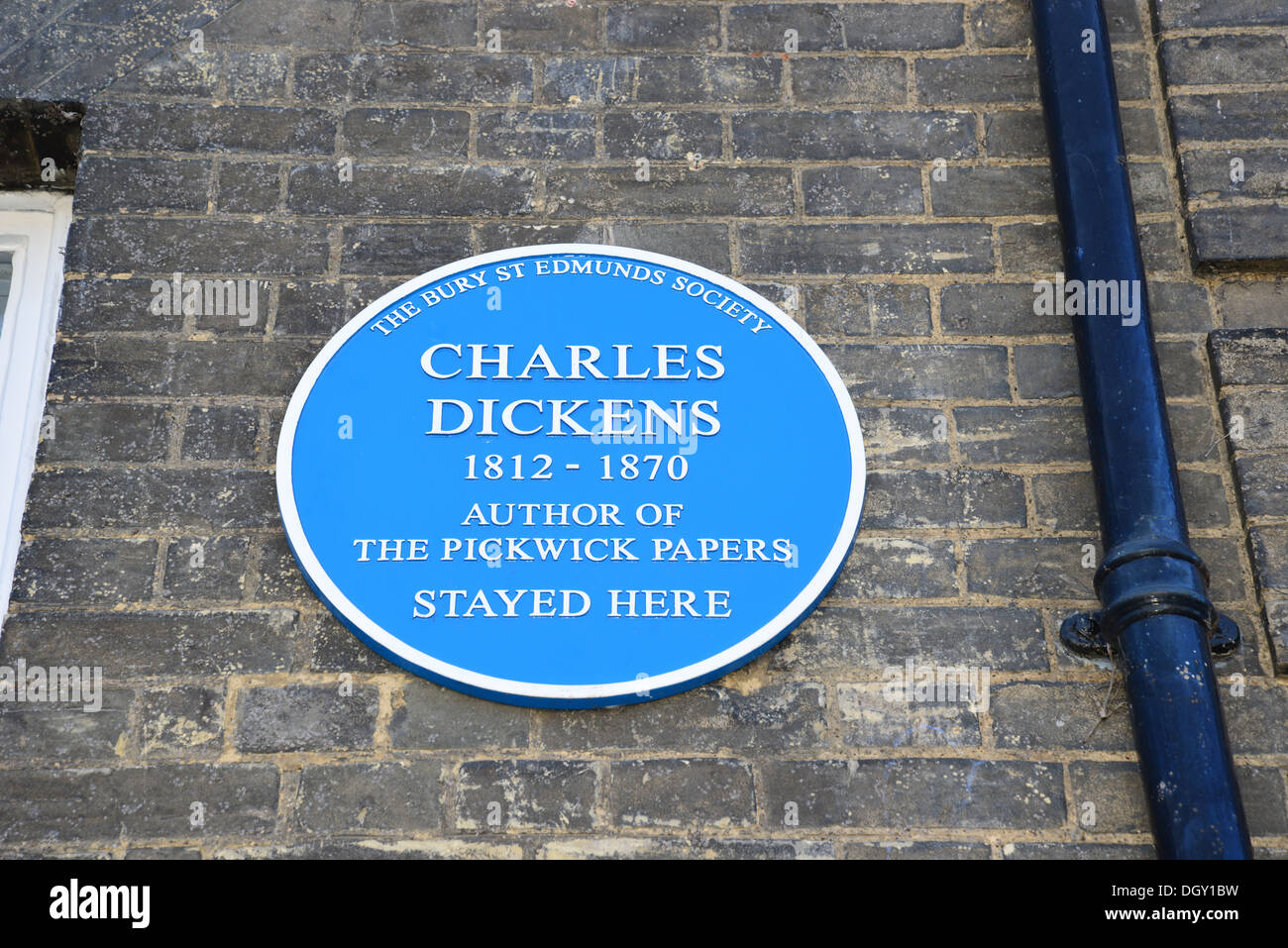 'Charles Dickens stayed here' blue plaque on front of Angel Hotel, Angel Hill, Bury St Edmunds, Suffolk, England, United Kingdom Stock Photo