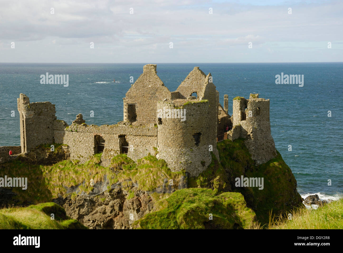 Ancient ruins Dunluce Castle on a cliff on the coast, County Antrim, Northern Ireland, United Kingdom, Europe Stock Photo