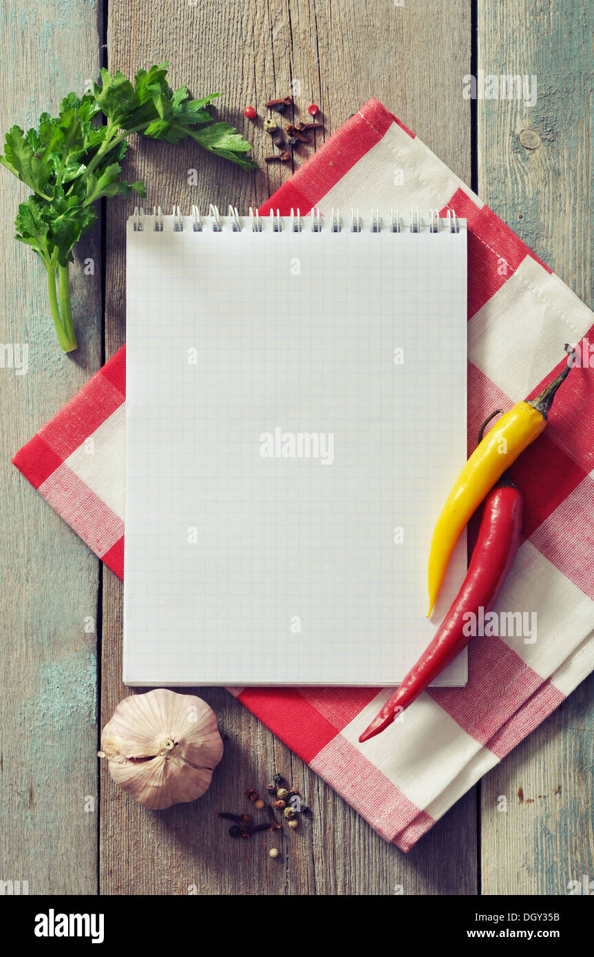 https://c8.alamy.com/comp/DGY35B/blank-recipe-book-with-kitchen-towel-on-wooden-background-DGY35B.jpg