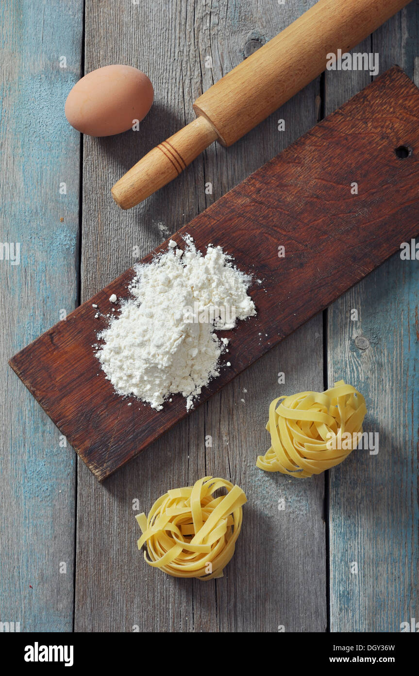 Flour, pasta and rollingpin on wooden background Stock Photo Alamy