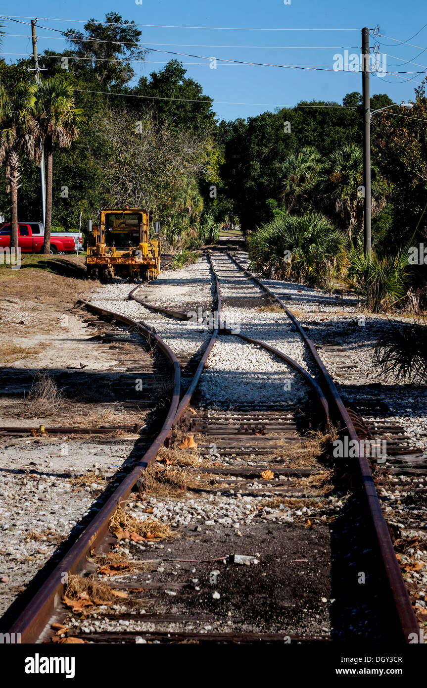 Old rusting abandoned railroad tracks line spur running through Mount Dora. Stock Photo