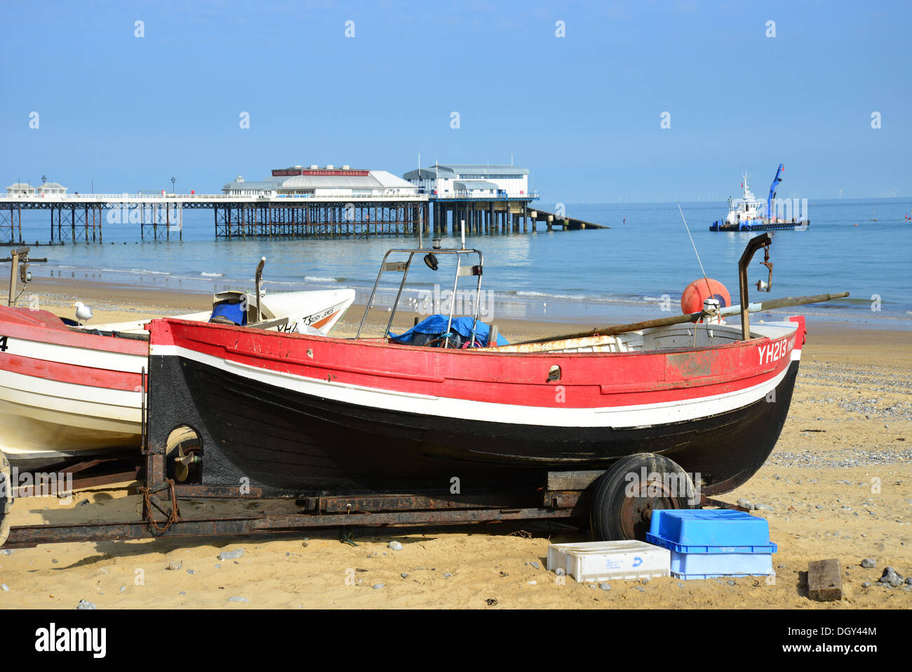 Wooden fishing boats on beach, Cromer, Norfolk, England, United Kingdom England, United Kingdom Stock Photo