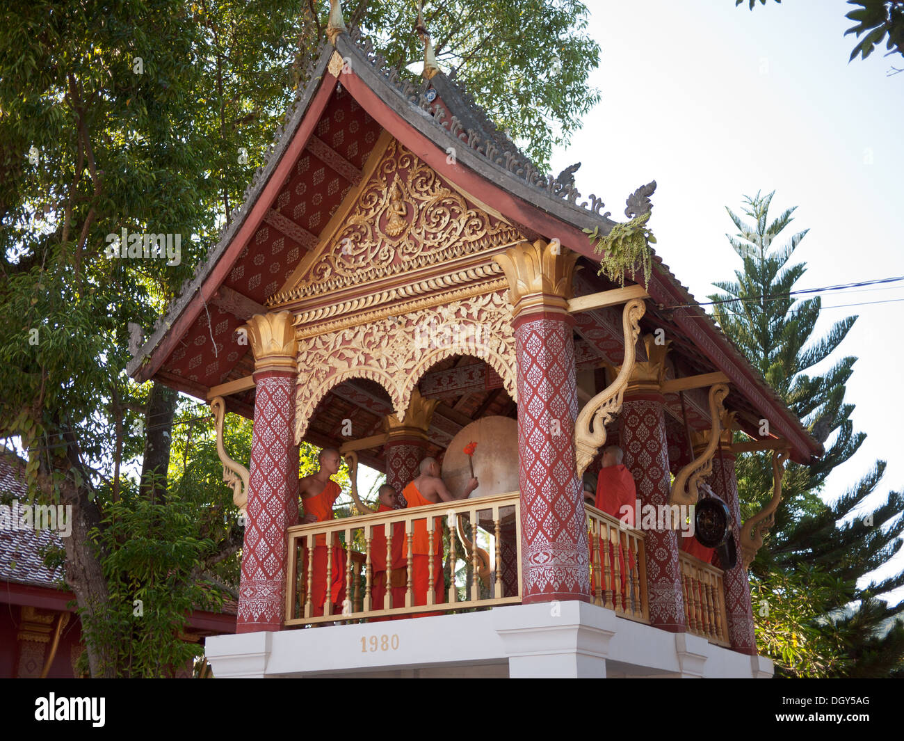 Buddhist monks play ceremonial drums at Wat Sen Buddhist temple in Luang Prabang, Laos. Stock Photo