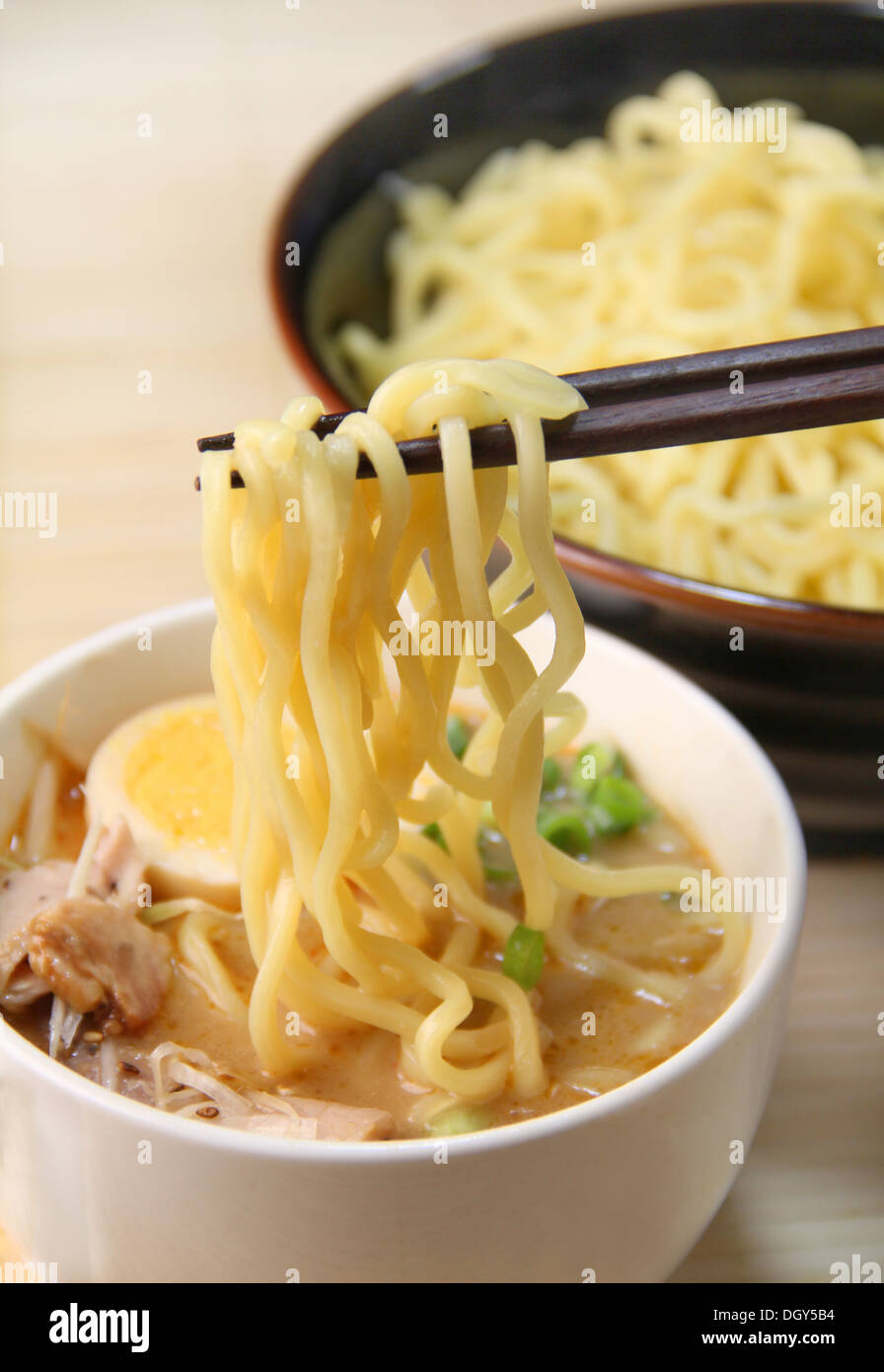 Dipping noodles Stock Photo