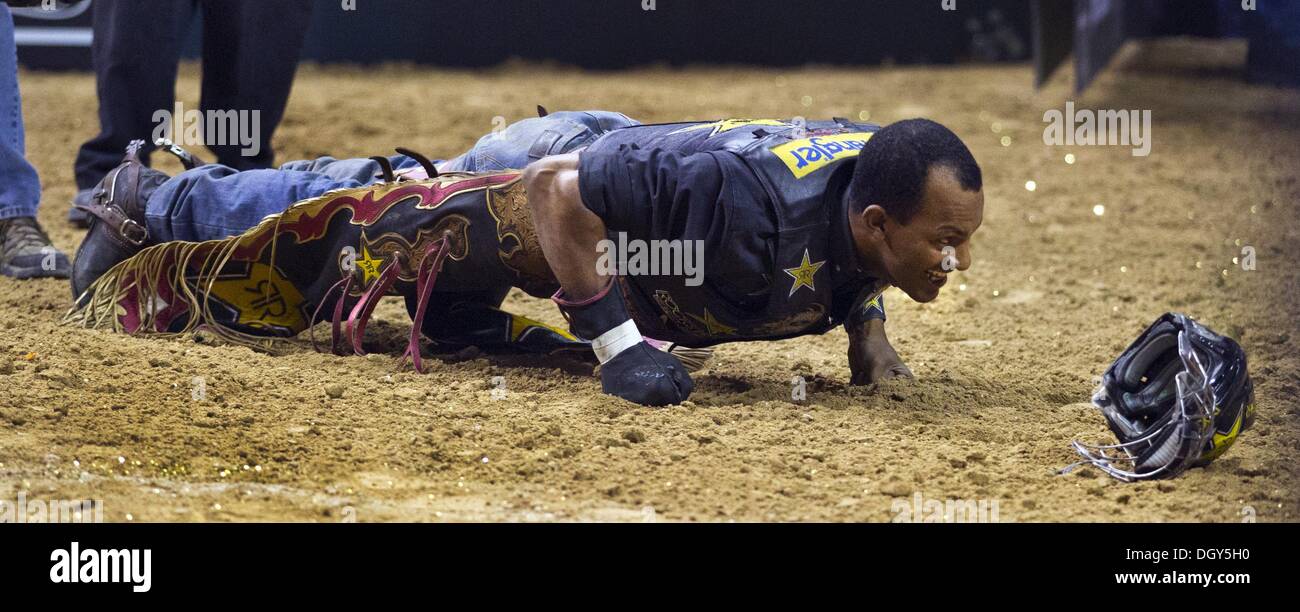Las Vegas, Nevada, USA. 27th Oct, 2013. Valdiron de Oliveira does a few push ups after a successful ride on Cheerio during the 2013 PBR Built Ford Tough World Finals at the Thomas & Mack Center on Sunday, Oct. 25, 2013. L.E. Baskow © L.E. Baskow/L.E. Baskow/ZUMAPRESS.com/Alamy Live News Stock Photo