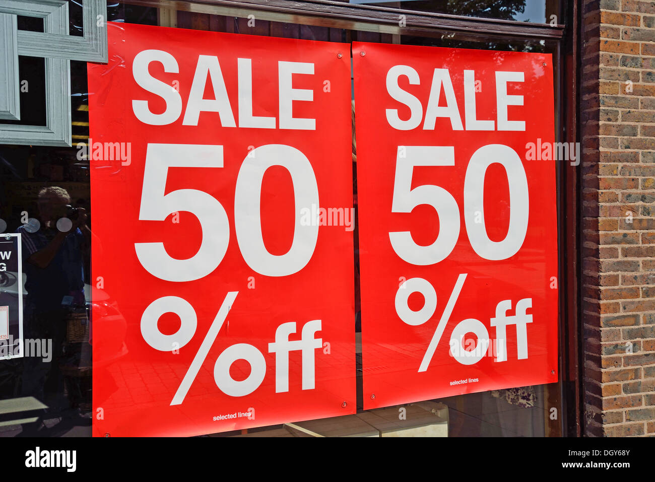 Sale sign in shop window, High Street, Ely, Cambridgeshire, England