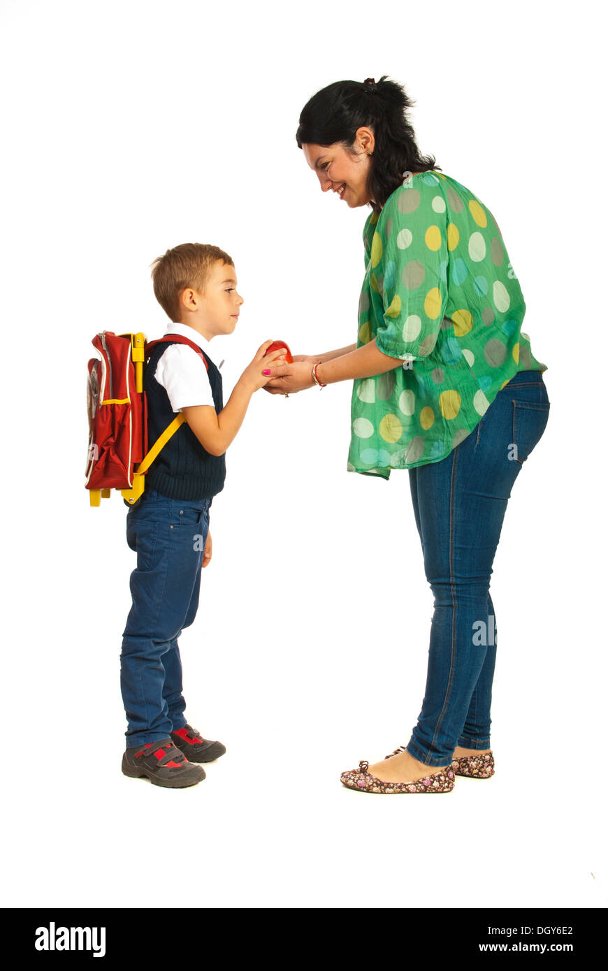 Mother giving apple to her son and prepare for school Stock Photo