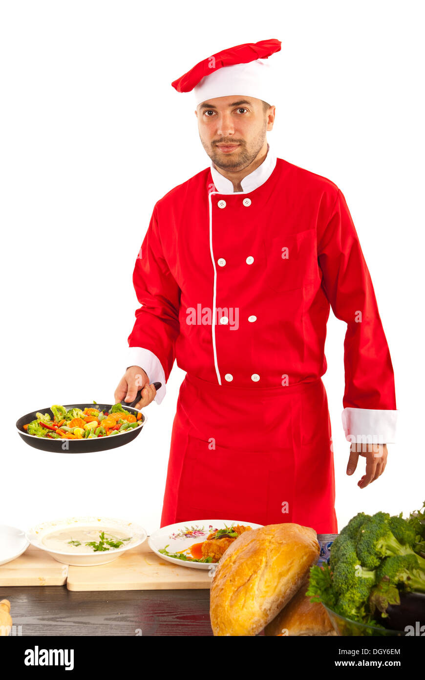 Chef male prepare vegetables in frying pan in kitchen Stock Photo - Alamy