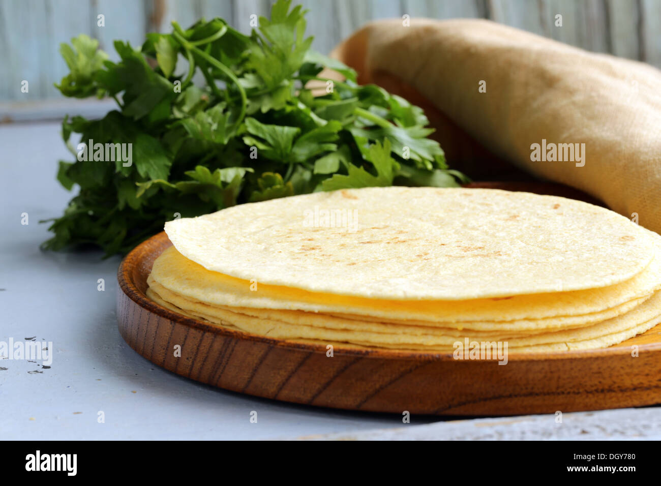 stack of corn tortillas on a wooden plate Stock Photo