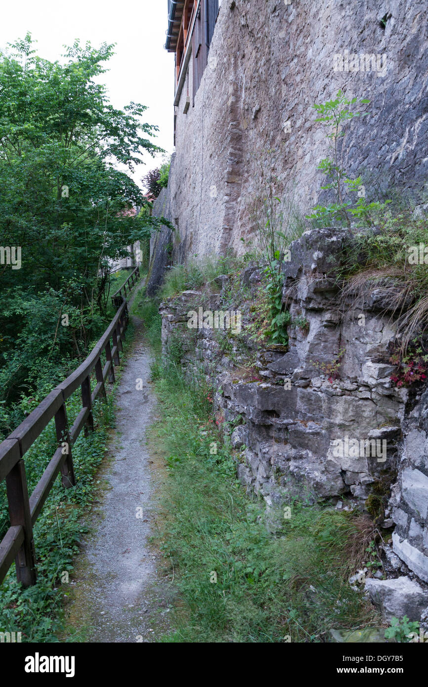 narrow foot path near the historic town of Vellberg, Germany. Steep wall at right side Stock Photo