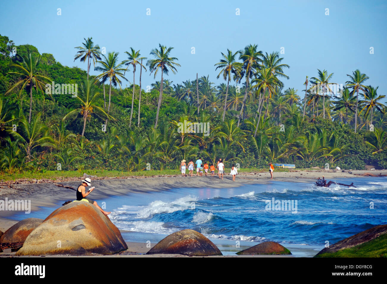 People walking along a sandy beach, Tayrona-Nationalpark, Santa Marta, Magdalena, Colombia Stock Photo