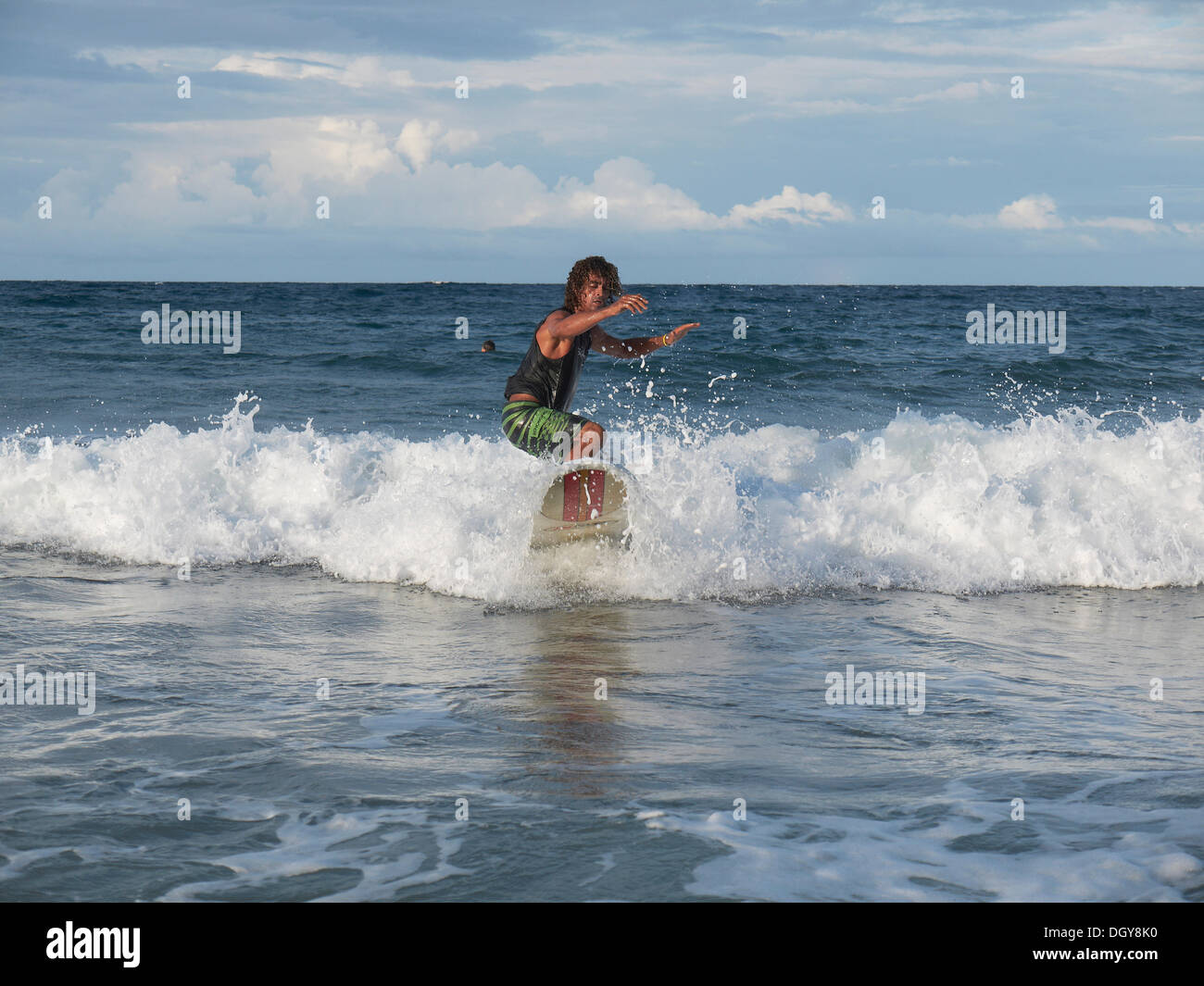 Surfer, 40, surfing a wave, Playa Cocles, Puerto Viejo de Talamanca, Costa Rica, Central America Stock Photo
