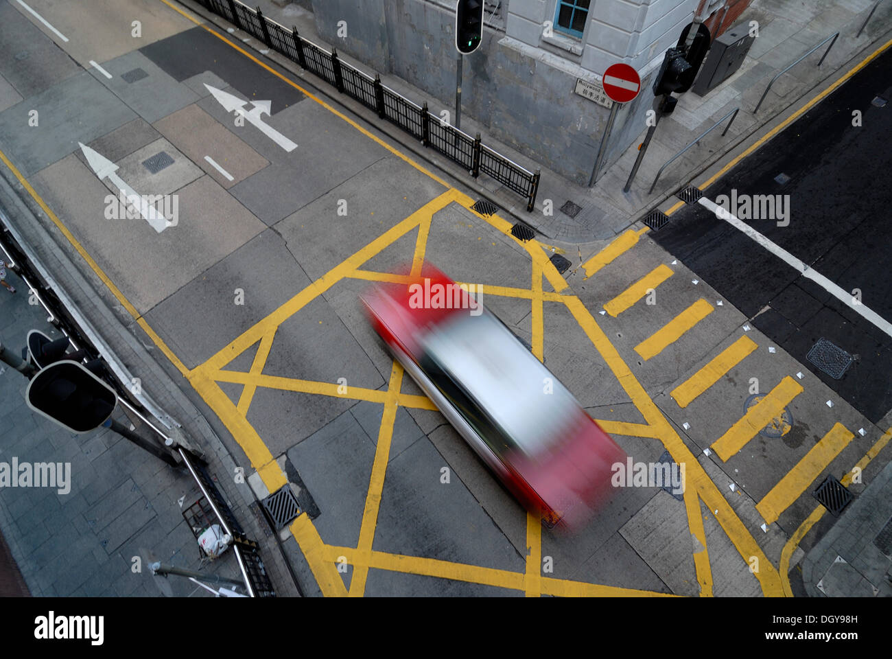 Taxi speeding across an intersection in Soho district, Central district, Hong Kong, China, Asia Stock Photo