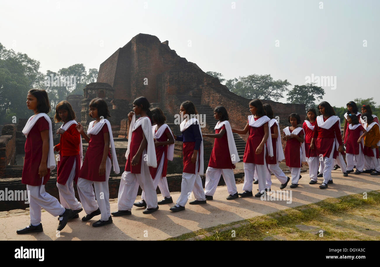 Indian pupils visiting an archaeological site and an important Buddhist pilgrimage destination, ruins of the ancient University Stock Photo