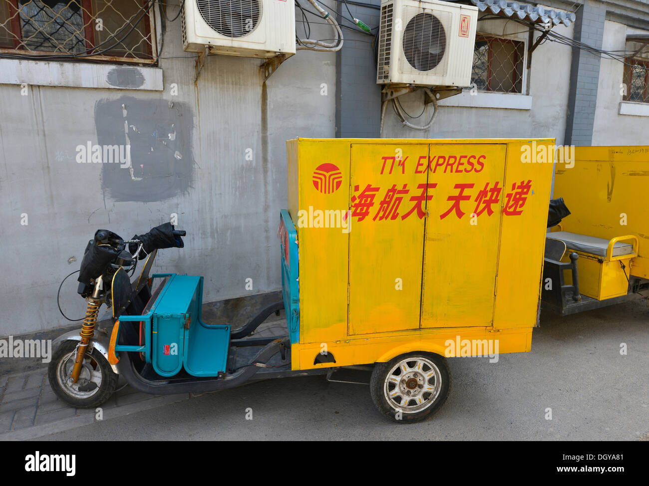 Post Express motorised rickshaw in an old traditional Hutong, a traditional courtyard in Beijing, China, Asia Stock Photo