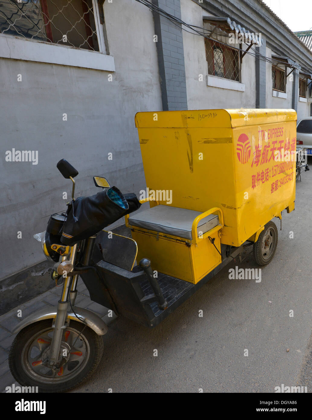 Post Express motorised rickshaw in an old traditional hutong, a traditional residential courtyard, in Beijing, China, Asia Stock Photo