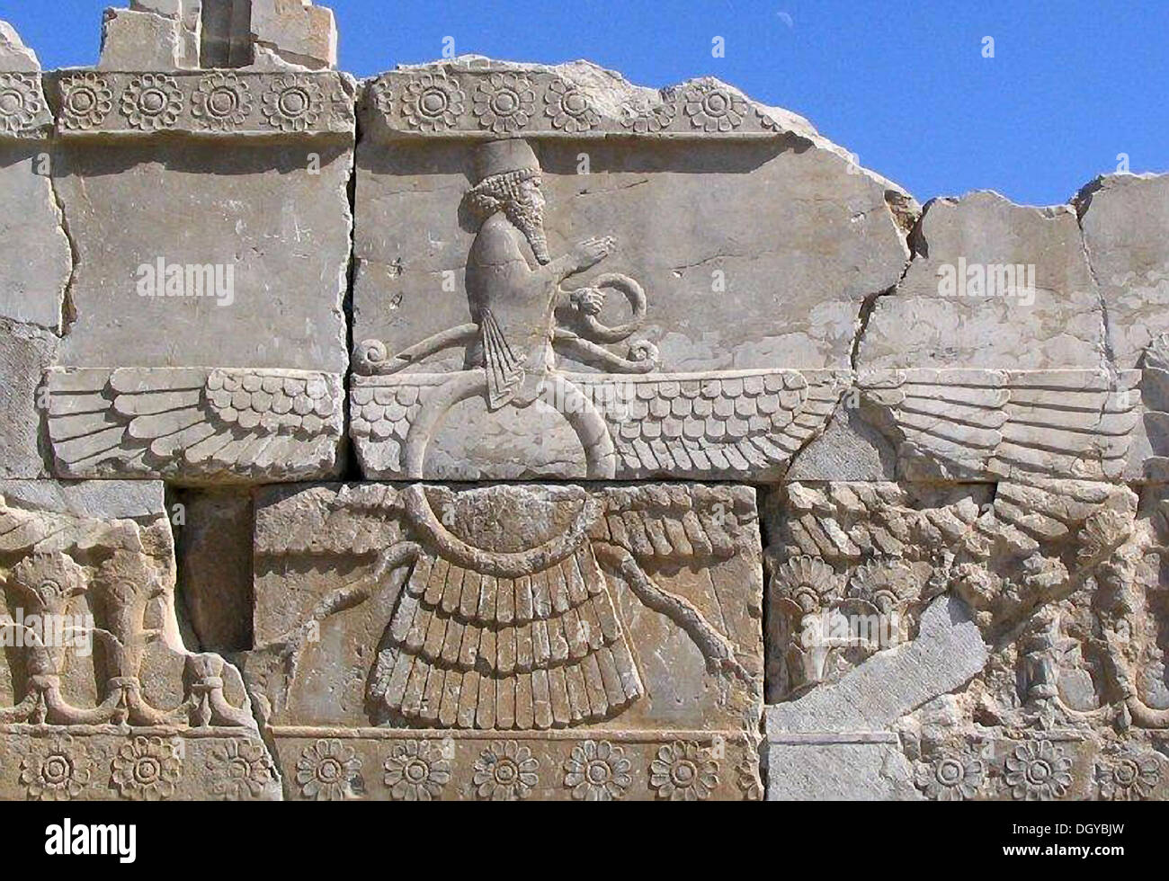 5719. The winged figure represents the God Ahuramazda in a winged disk, the symbol indicates that the authority of the king comes from God. Persepolis. King Darius’ palace, c. 6th. C. BC. Stock Photo