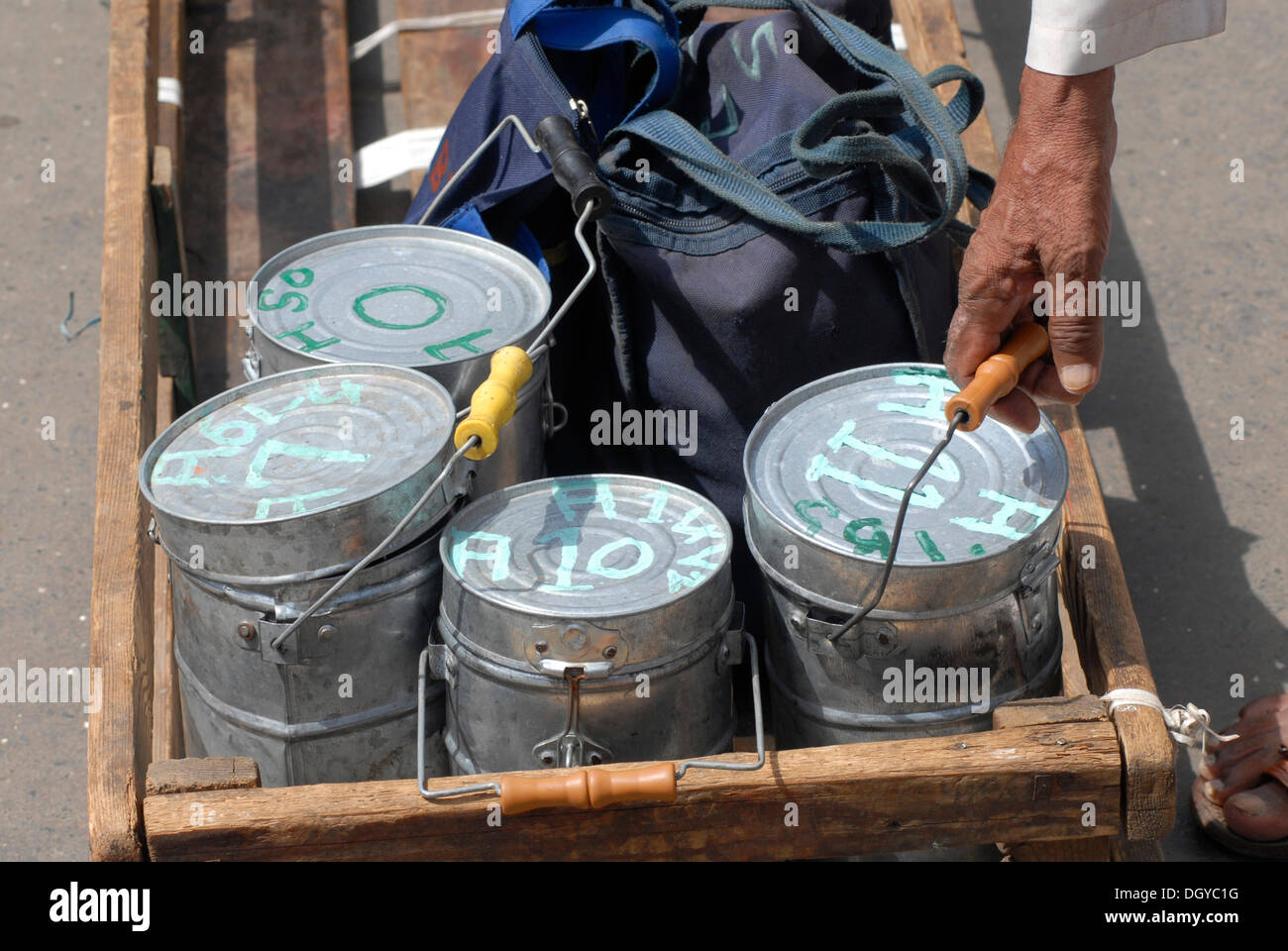 Dabbas or food containers marked with characters to allow correct ...