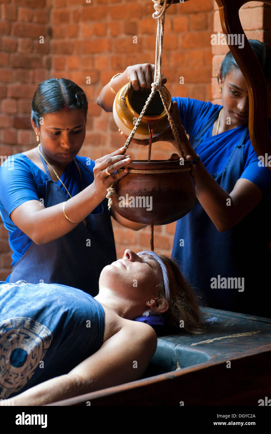 Shirodhara, Ayurvedic treatment, oil is gently poured over the forehead of a women, Somatheeram Ayurvedic Health Resort, Chowara Stock Photo