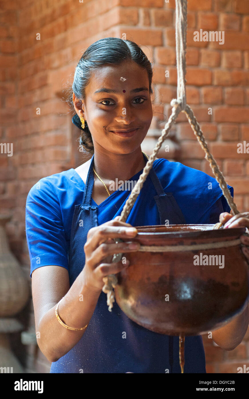 Woman applying Ayurvedic treatment, Somatheeram Ayurvedic Health Resort