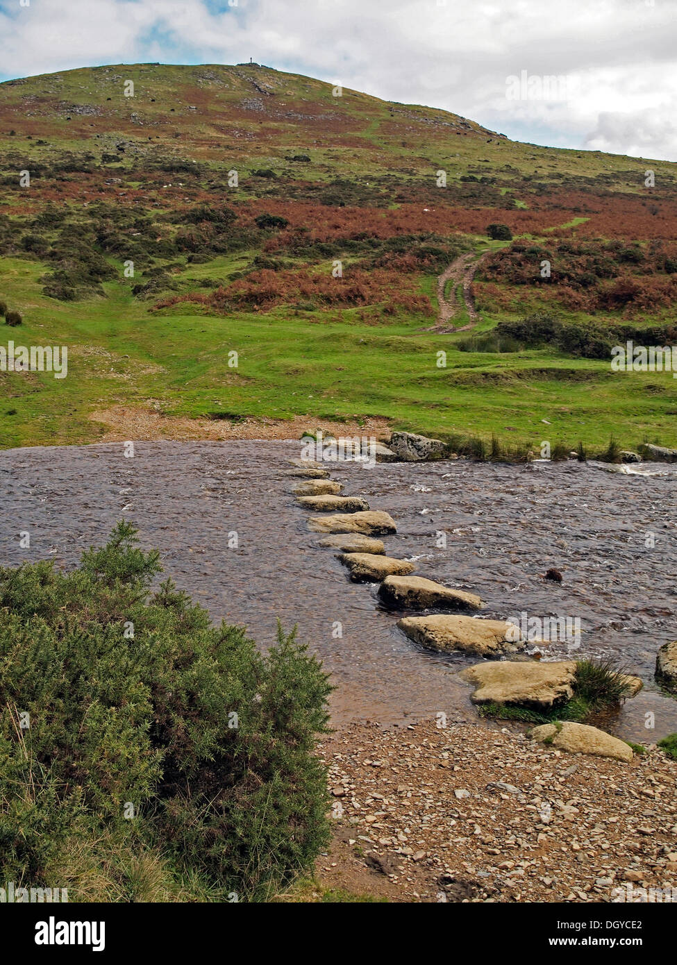View towards Brat Tor (Widgery Cross) from a ford and stepping stones on the upper River Lyd, Dartmoor near Lydfiord, Devon Stock Photo