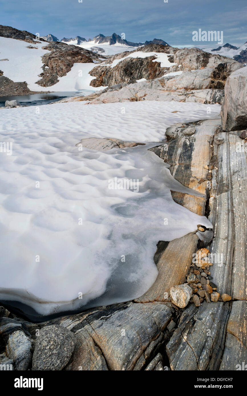 Snow, ice and rock formations at the Mittivakkat Glacier, Ammassalik Island, East Greenland, Greenland Stock Photo