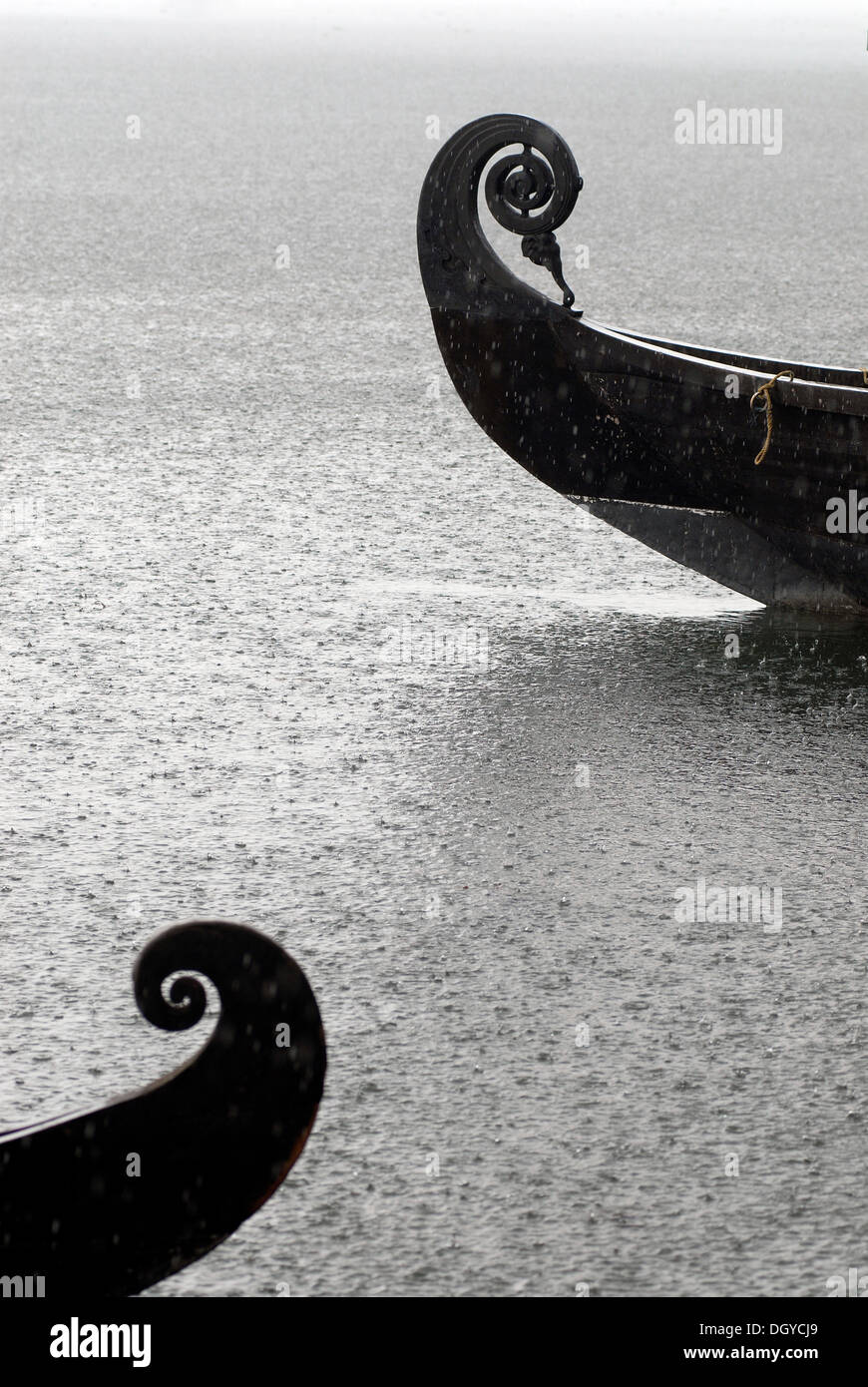 Wooden boats in the rain, Vembanad Lake, Kerala, Malabar coast, South India, India, Asia Stock Photo
