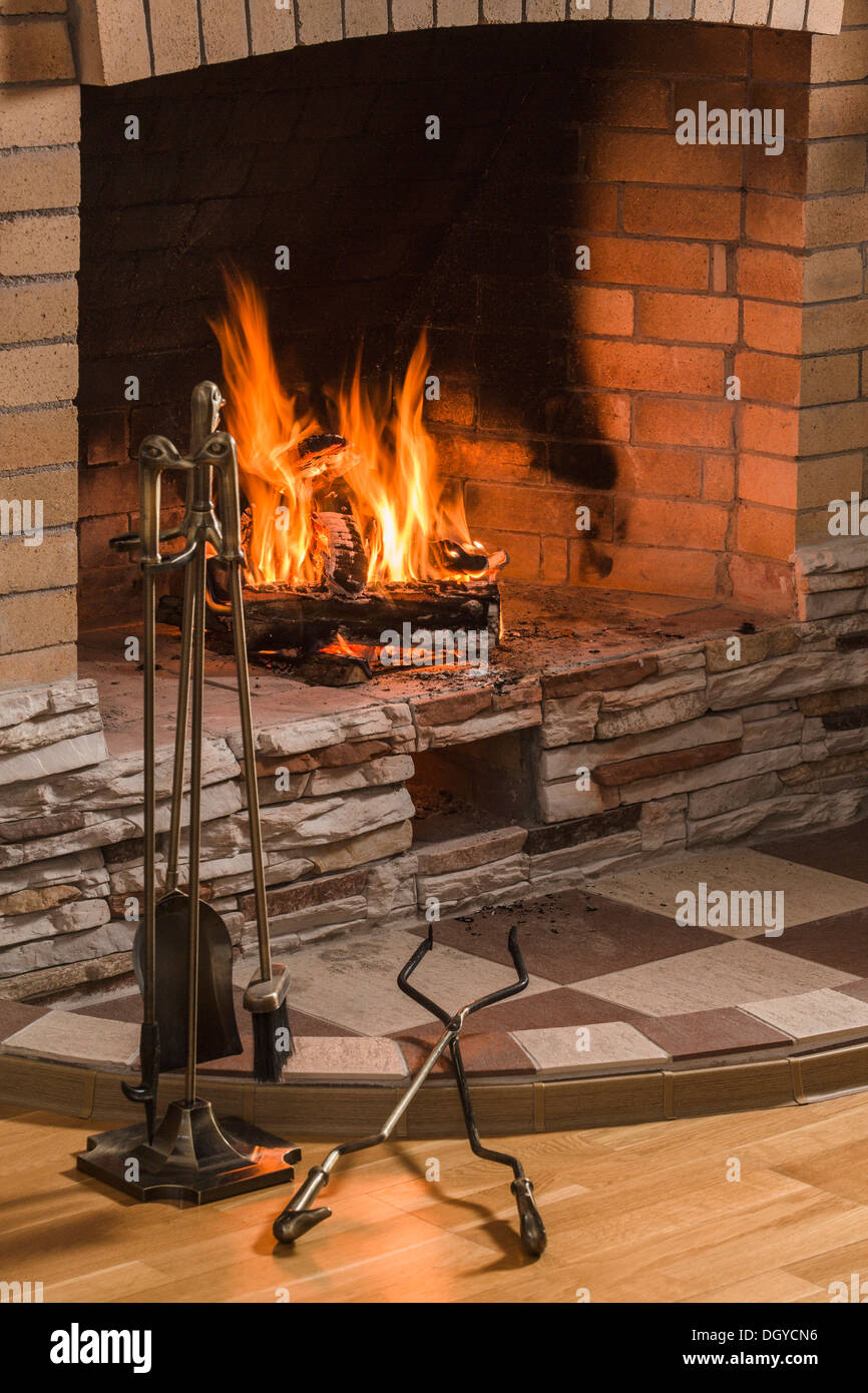 Open fire, hearth and hearth tool set Stock Photo