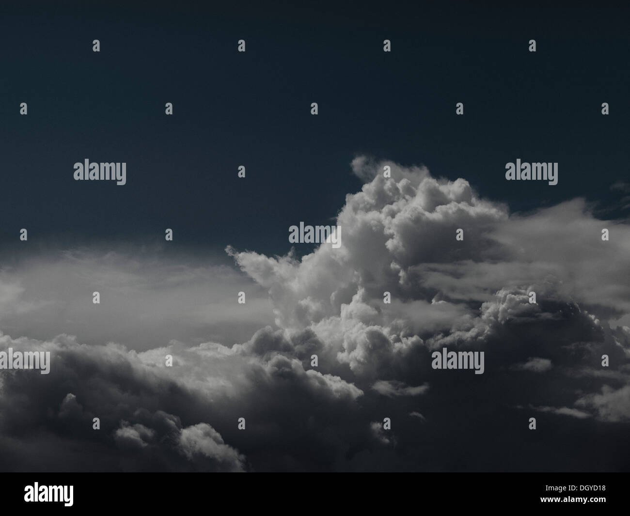 A cloudscape against a dark sky Stock Photo