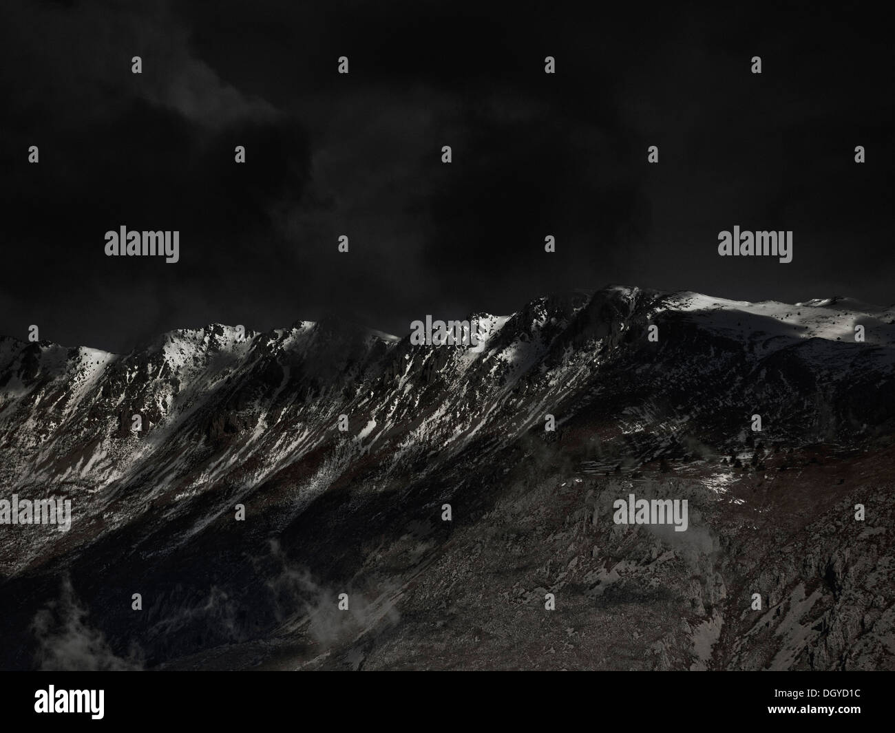An ominous sky above a mountain range Stock Photo