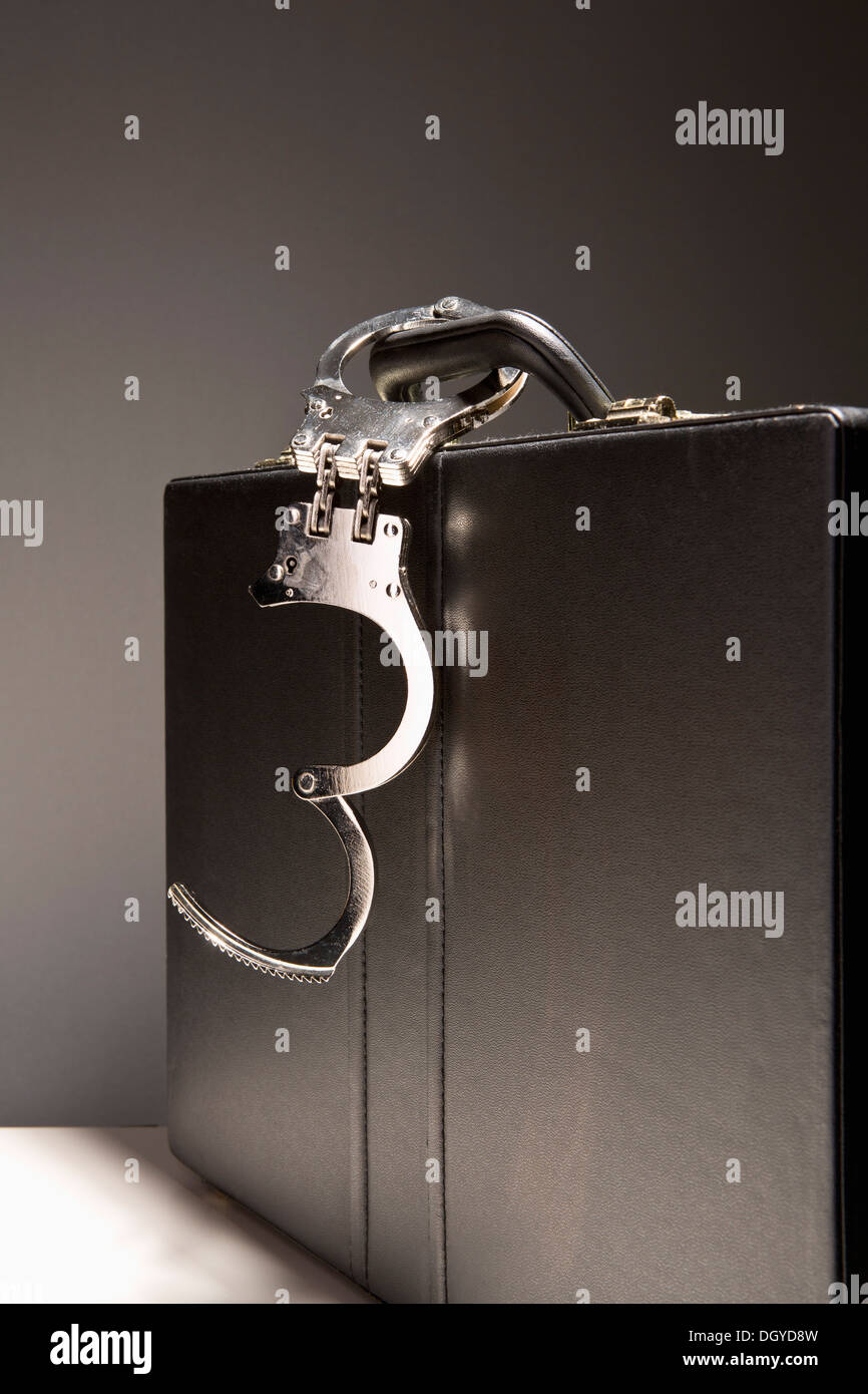 Handcuffs attached to briefcase hires stock photography and images Alamy