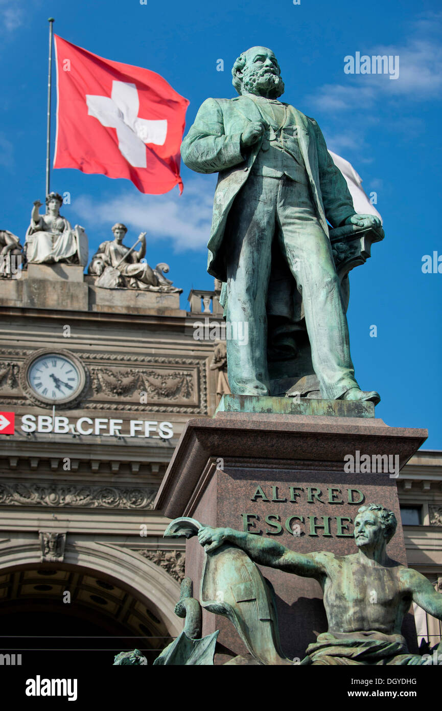 Swiss flag flying behind the statue of Alfred Escher, Swiss politician, business leader and railway pioneer, by Richard Stock Photo