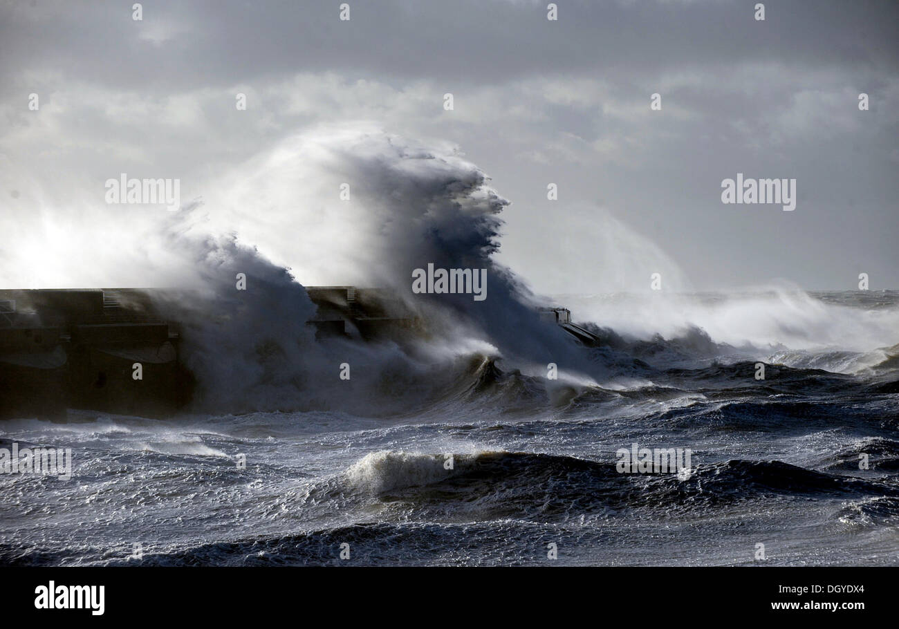 Massive waves crash over Brighton Marina as storms battered the south coast this morning The storm, called St Jude, brought the windiest weather to hit the UK since 1987. Stock Photo