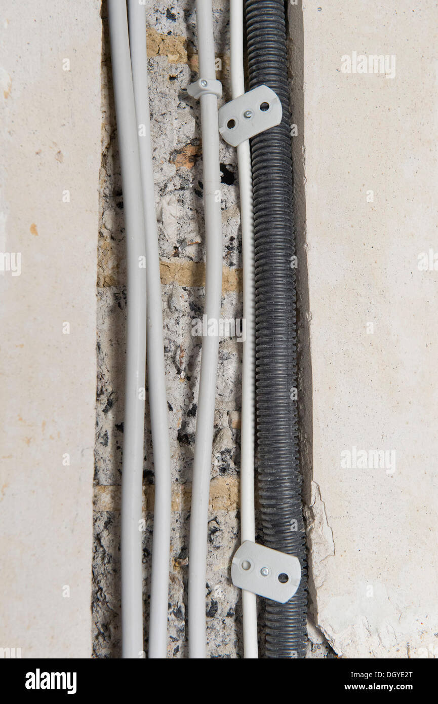 Electric cables laid in a cable canal to be flush under plaster in an old building, Stuttgart, Baden-Wuerttemberg Stock Photo