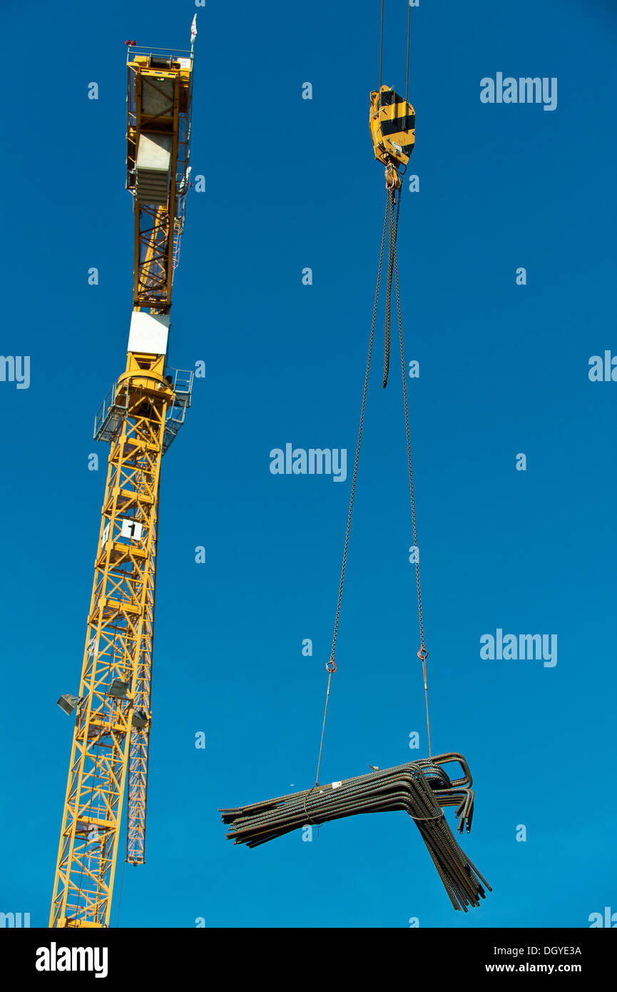 Reinforcing steel being lifted by a crane, on steel cables, Stuttgart, Baden-Wuerttemberg Stock Photo