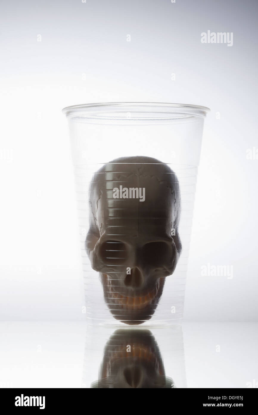 Toy skull in disposable cup Stock Photo