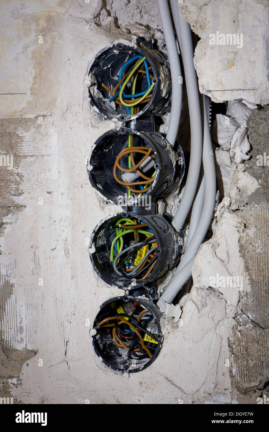Electric cables in new socket holes to be flush under plaster in an old building, Stuttgart, Baden-Wuerttemberg Stock Photo