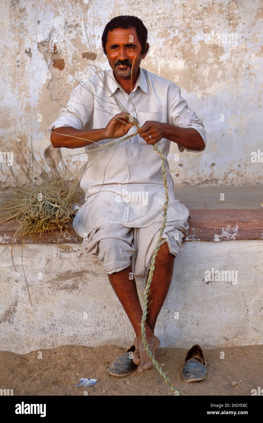 Man producing a rope, village of Katariyasar near Bikaner, Rajasthan ...