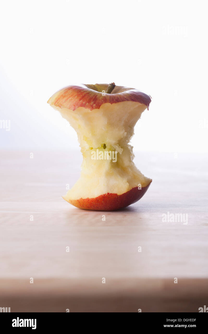 A fresh apple core on a table Stock Photo