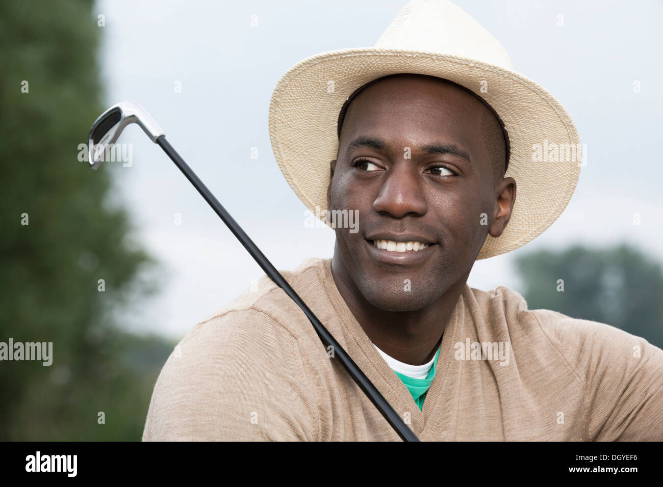 Man relaxing at the golf course Stock Photo