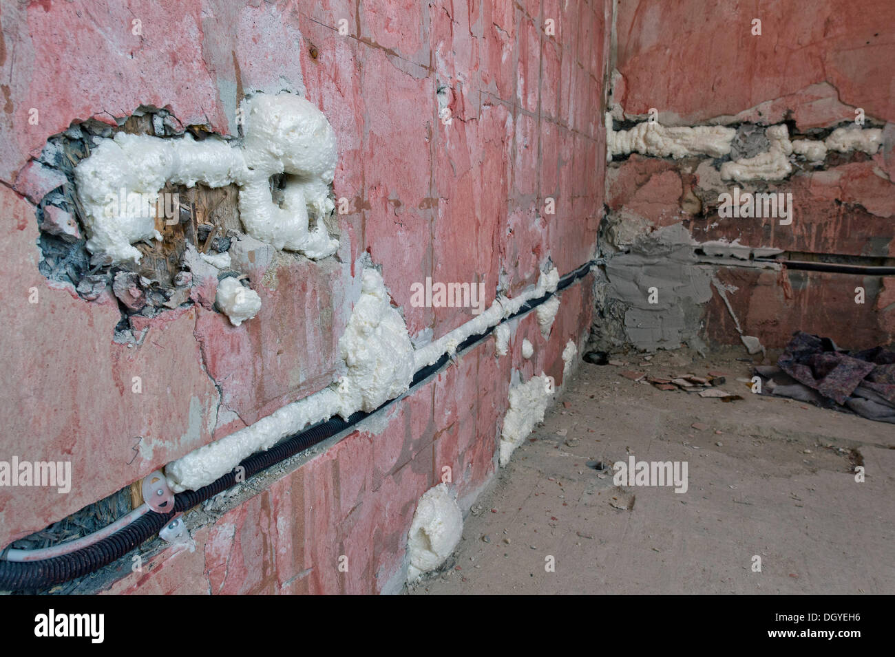 Cable channels, wall cavities filled with foam insulation, renovation