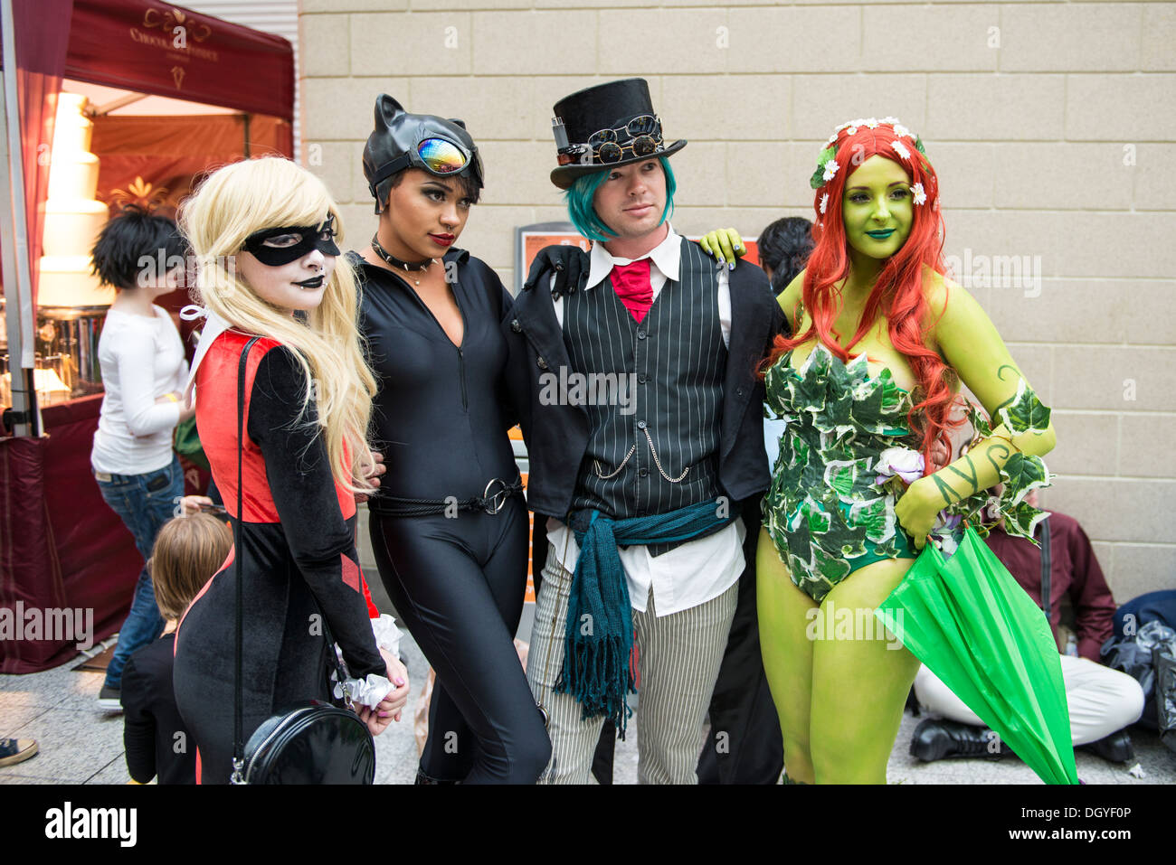 LONDON, UK - OCTOBER 26: Cosplayers dressed as a Harley Quinn, Catwoman and Poison Ivy from Batman for the Comicon Stock Photo
